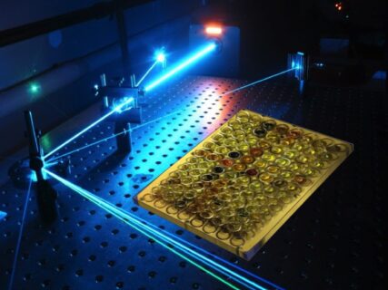 The image shows a laser experiment in a laboratory.